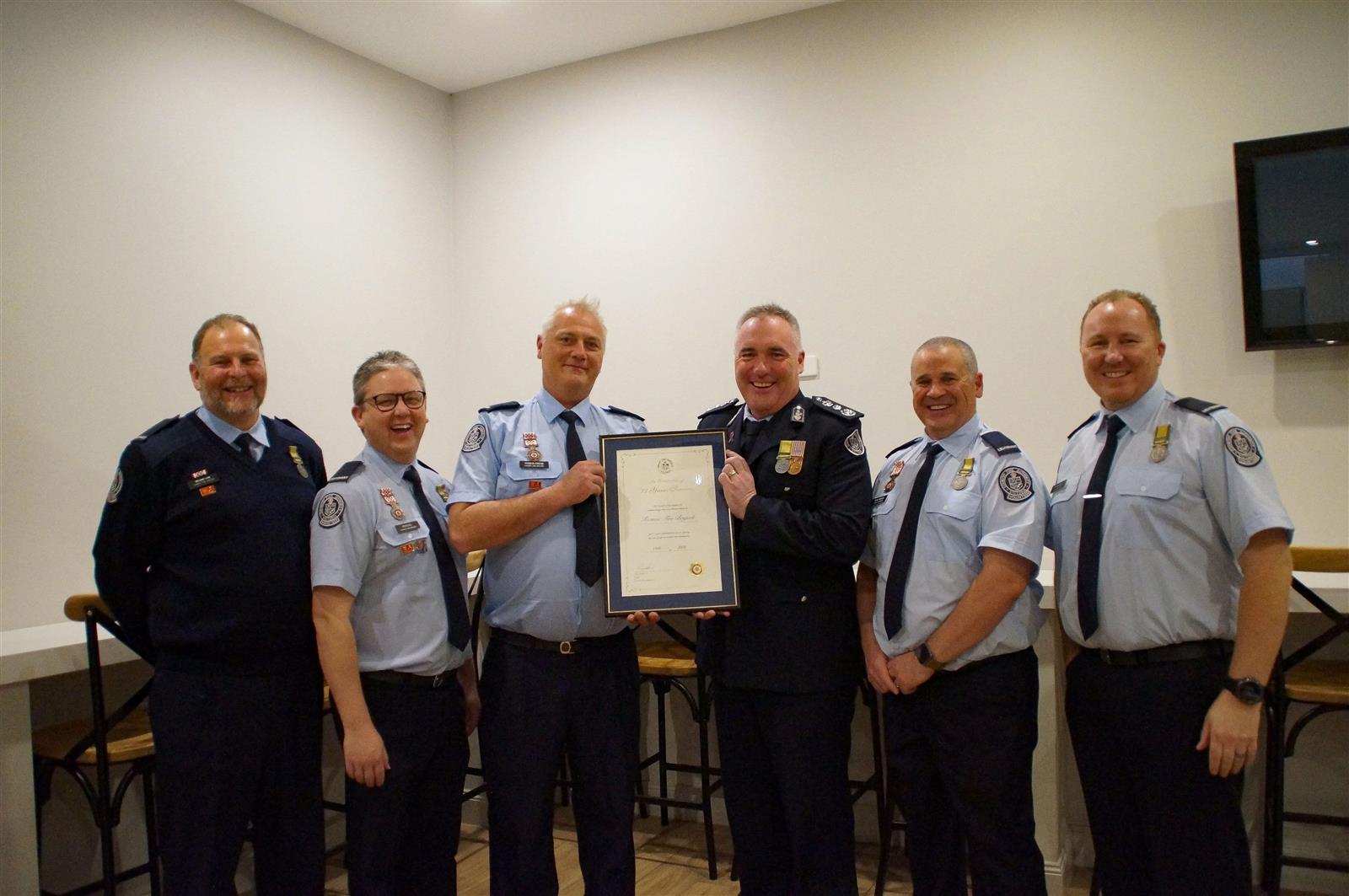 Chief Officer Jason Heffernan presenting a service certificate to Toomuc brigade